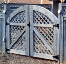 arched lattice wood gate by Elyria Fence